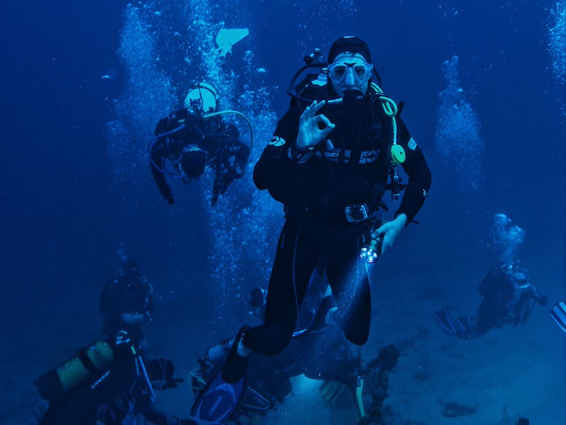 Diver giving the OK sign during the ascent